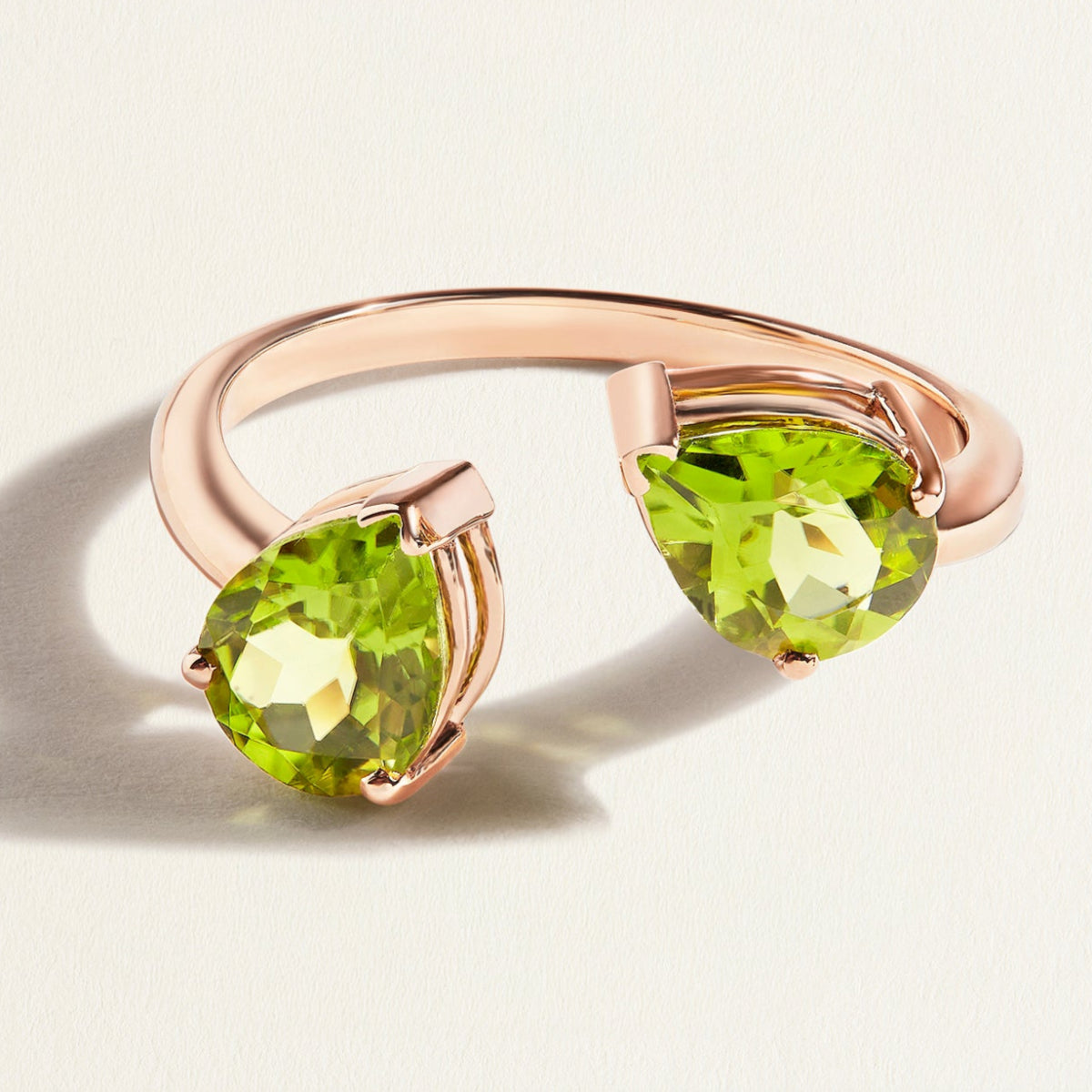 Rose gold toi et moi open ring with pear green peridot gemstones