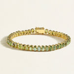 A solid 14 k gold tennis bracelet with upright oval cabochon green tourmalines in 13 carats, evoking the freshness of garden dew.