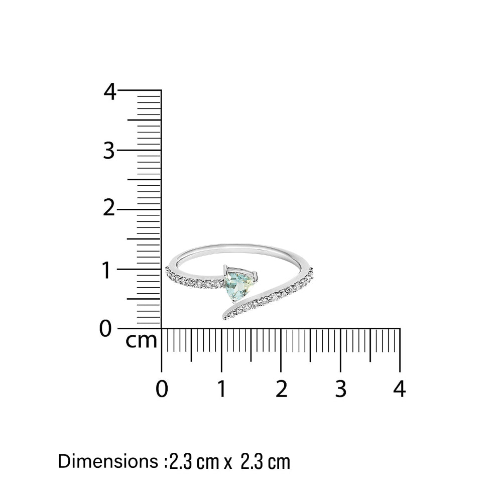 White gold sleek diamond spiral Ring with a blue aquamarine gemstone next to a ruler showing its dimensions on a white background