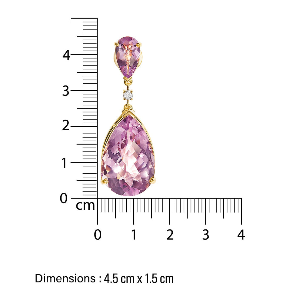 chandelier Purple amethyst teardrop-shaped earrings in 14 k gold  and diamond accents next to a ruler showing their dimensions.