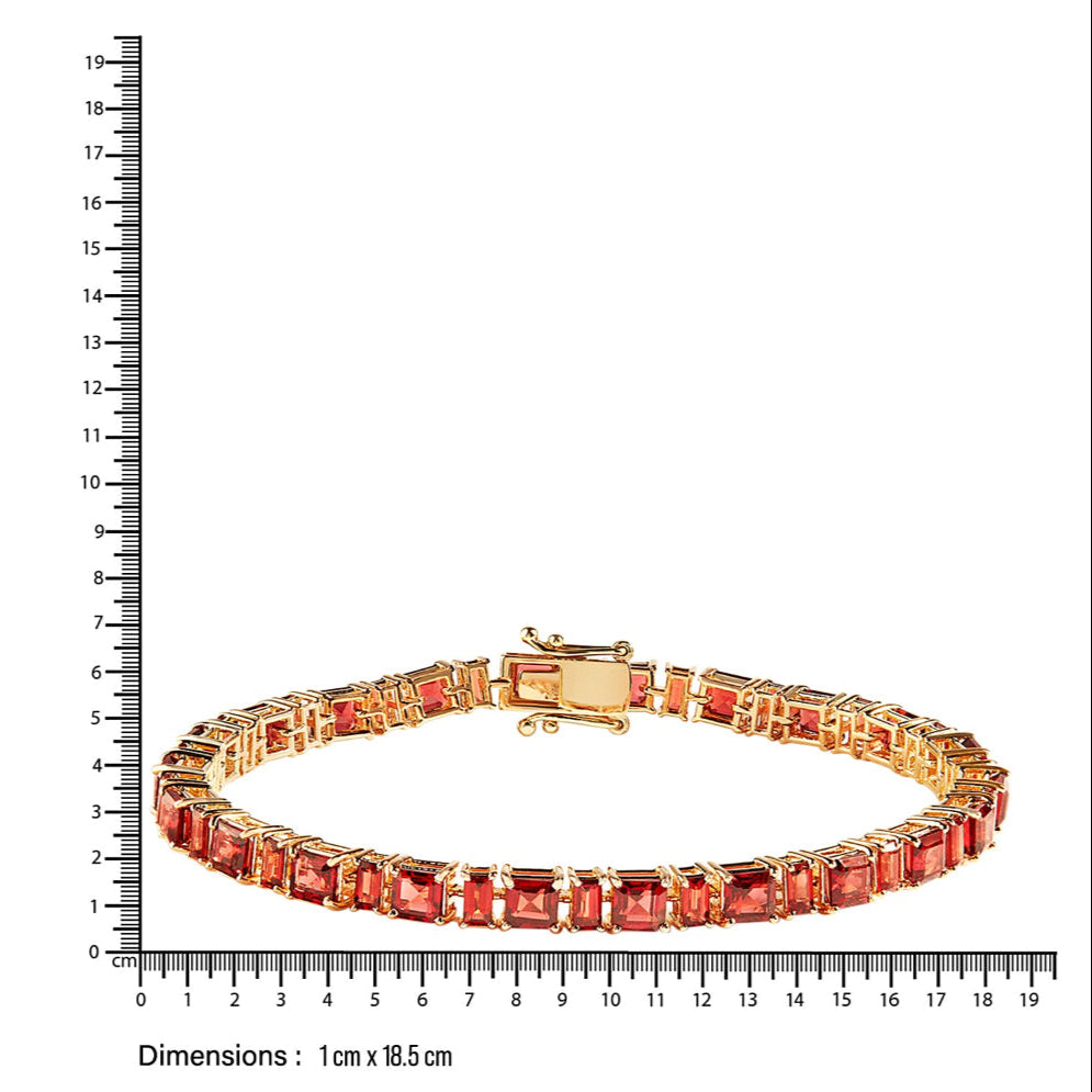 Closer Gold bracelet with natural garnets  next to a ruler for size reference on a white background