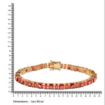Closer Gold bracelet with natural garnets  next to a ruler for size reference on a white background