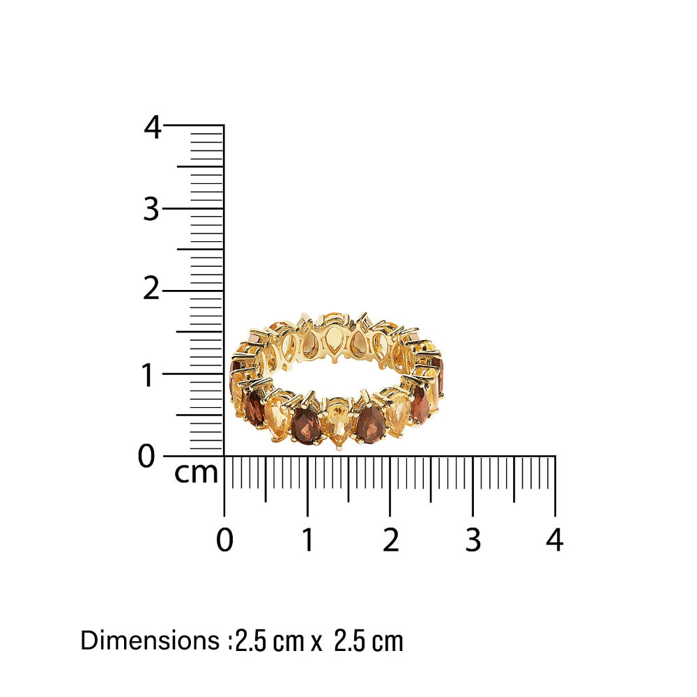 Gold eternity ring with pear shaped brown and yellow smoky quartz and citrines stones next to a ruler showing its dimensions on a white background