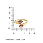 Gold ti et moi ring with pink tourmaline gemstones next to a ruler showing dimensions on a white background