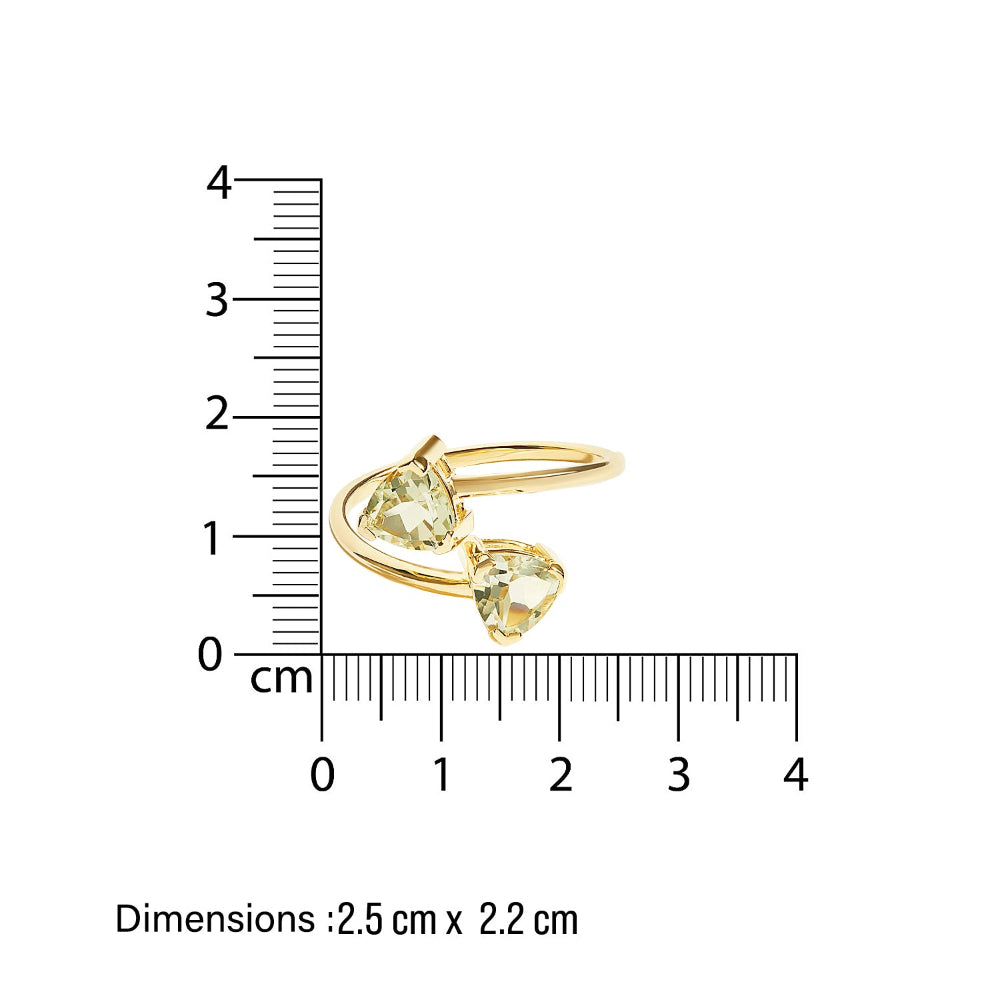 Gold toi et moi ring with trillion-shaped green amethyst gemstones next to a ruler on a white background