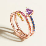 rose gold spiral ring in rainbow sapphires with purple amethyst on top